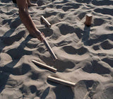 Playing Kubb Game in Sand