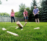 Playing Kubb Game in the Yard